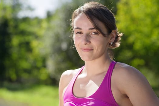 portrait of a young sporty woman in the countryside