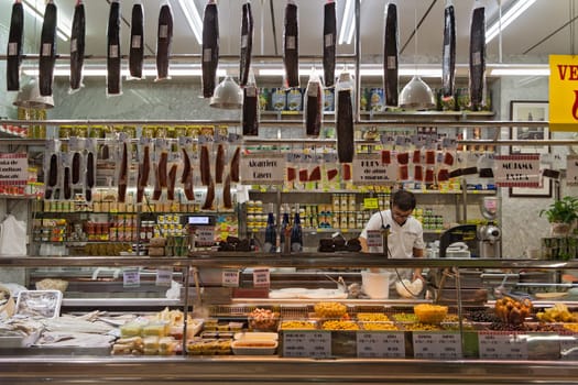Sale stand in the market hall of Russafa in Valencia, Spain