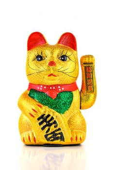 Waving cat,gold-plated welcome cat with waving paw against a white background