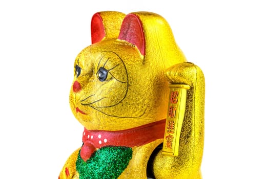 Waving cat,gold-plated welcome cat with waving paw against a white background