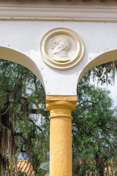 Face of Simon Bolivar over a column in Villa de Leyva, Colombia