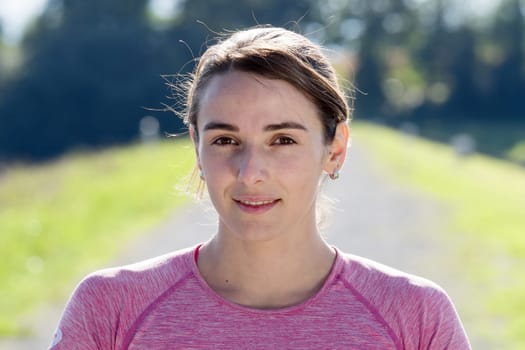 portrait of a young sporty woman in the countryside