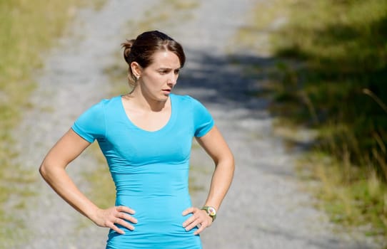beautiful young sporty woman in the countryside