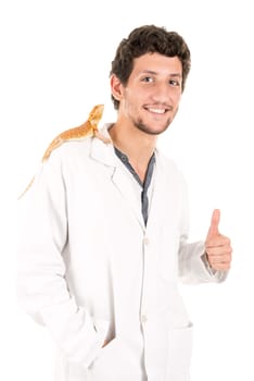 Young veterinarian with lizard isolated in white
