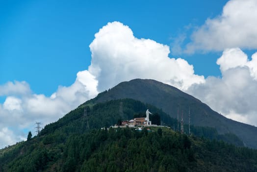 View of Guadalupe Hill with a statue of the Virgin of Guadalupe on it overlooking Bogota, Colombia