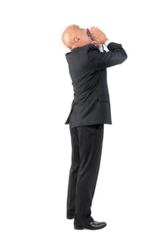 Businessman shouting isolated against a white background