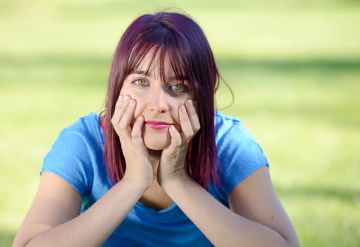 portrait of a young woman with green eyes, outdoors