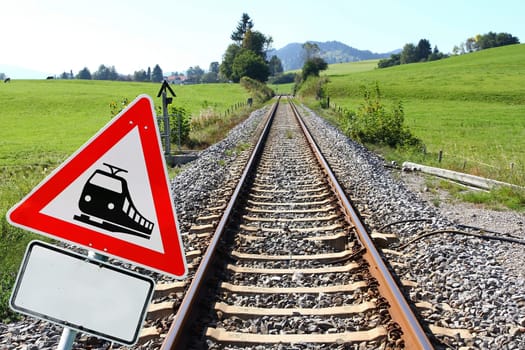 Die Deutsche Bahn. Railway sign and railway tracks