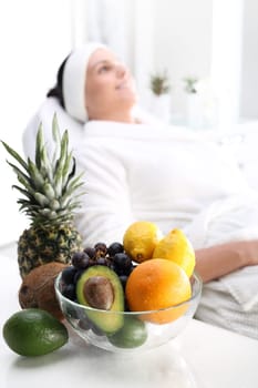 fruit acids,cosmetic procedure.\ntreatment with fruit acids,a woman in a beauty salon.\nbeautiful young woman in a beauty salon.\n