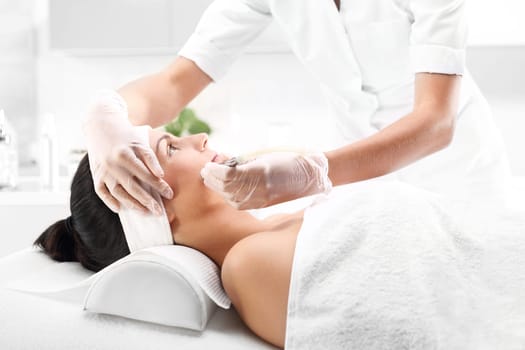 a woman's face during a treatment at a beauty salon\n