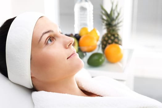fruit acids,cosmetic procedure.\ntreatment with fruit acids,a woman in a beauty salon.\nbeautiful young woman in a beauty salon.\n