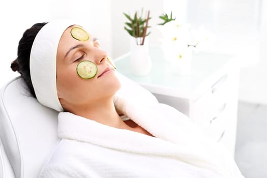 cucumber mask. skin care treatment in the beauty salon\n