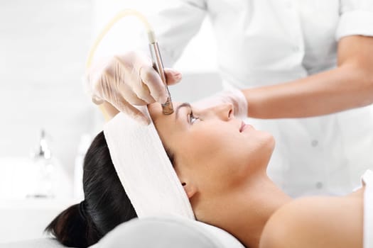 diamond dermabrasion,peeling exfoliation.\ndiamond microdermabrasion,cosmetic scrub\noksydermabrazja\nwoman at the beautician,microdermabrasion treatment\n