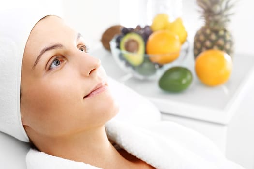 fruit acids,cosmetic procedure.\ntreatment with fruit acids,a woman in a beauty salon.\nbeautiful young woman in a beauty salon.\n