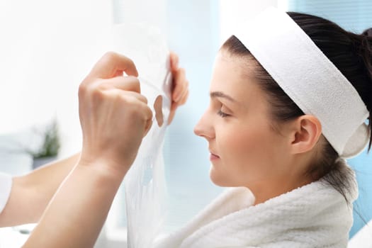 a woman's face during a treatment at a beauty salon\n