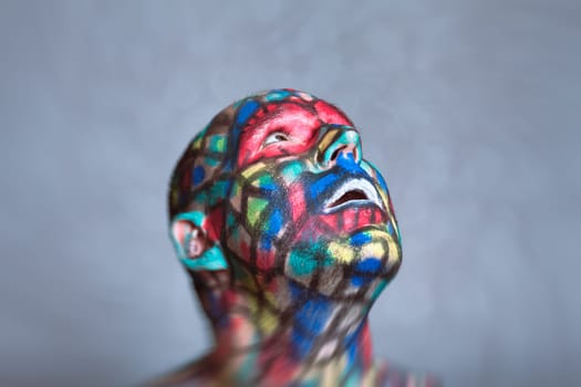 Surprised Superhero portrait, colorful face art with tilt shift and motion blur effect.