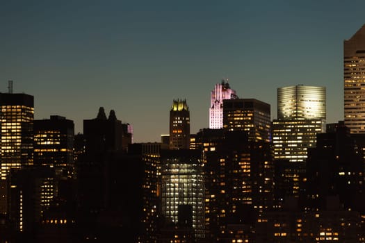Manhattan skyline detail with skyscrapers during twilight in New York City, USA.