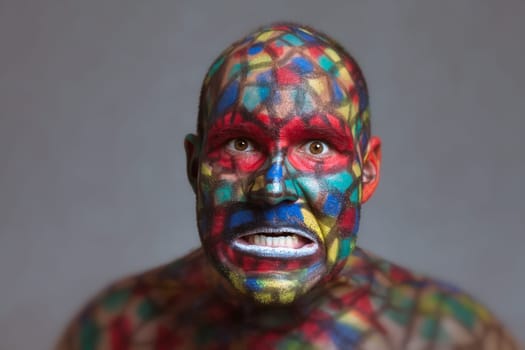 Furious villain portrait, colorful face art with tilt shift and motion blur effect.
