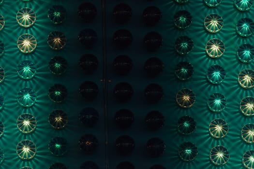 Amusement park background detail with green and yellow lights.