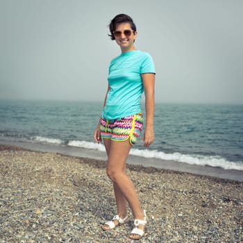 Woman near the sea. Foggy weather