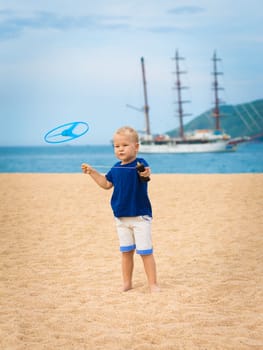 Boy with flying saucer outdoor. Leisure activity