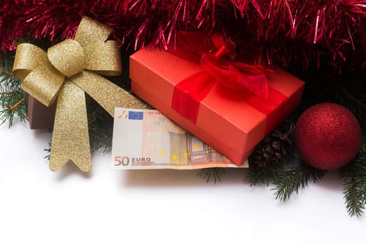 christmas gift box with euro money on white background