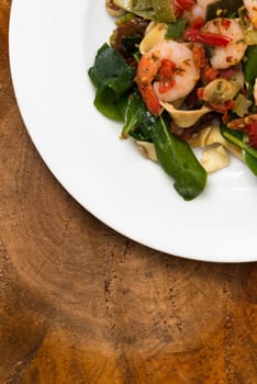 fresh salad of prawns,baby spinach and chili,rustic style,top view