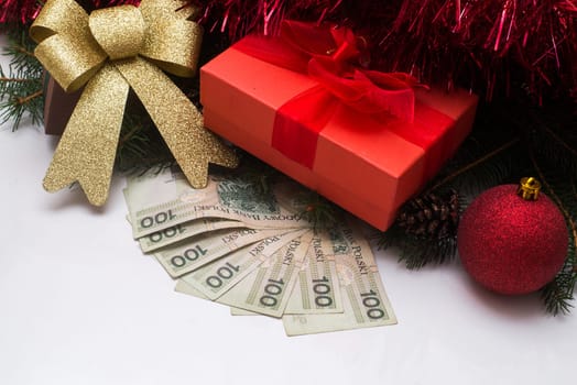 christmas gift box with polish pln money on white background