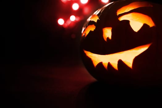 scary halloween pumpkins on a red light background.