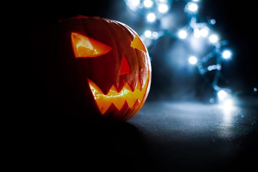 scary halloween pumpkins on a blue light background.