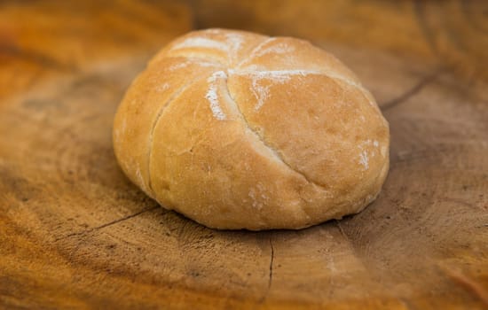  homemade bread rolls on wood background