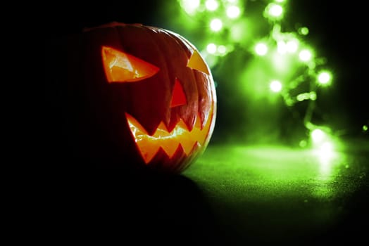 scary halloween pumpkins on a green light background.