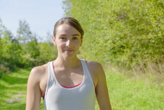 portrait of a young sporty woman in the countryside