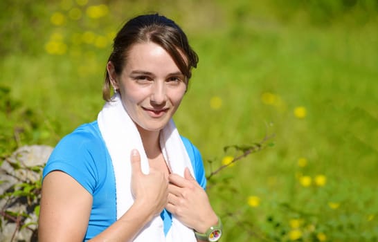 beautiful sporty young  woman relaxing after exercising