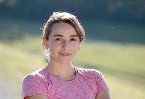 portrait of a young sporty woman in the countryside