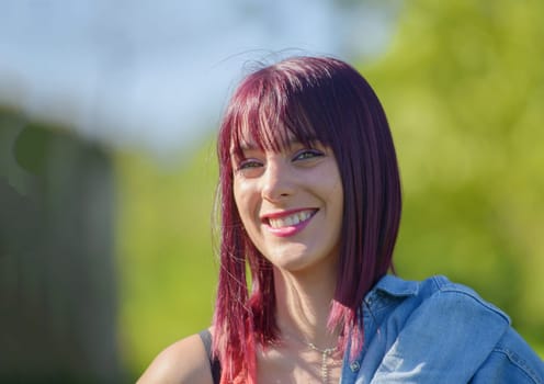 portrait of beautiful young woman with red hair, outdoors