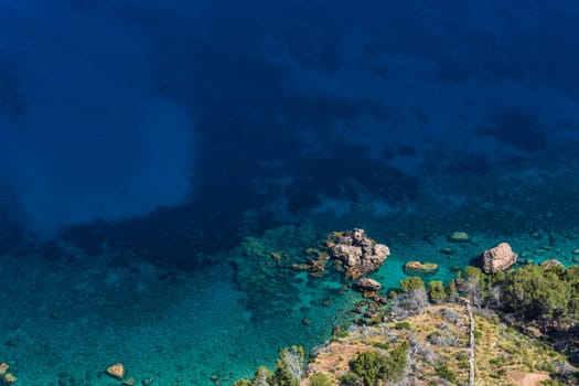 Sea waves and rocks on the steep west coast of Mallorca. .