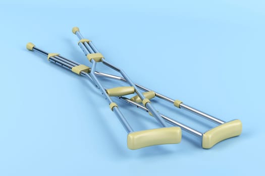 Pair of underarm crutches on blue background