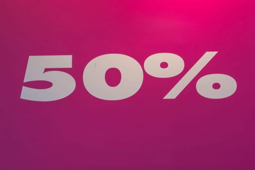 Sign with the number 50% discount on red background.