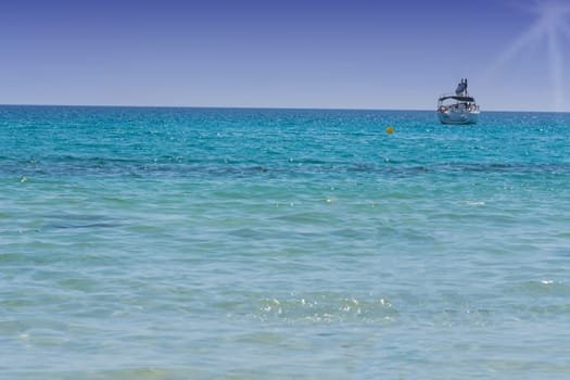 Beautiful sea view with sailing yacht on the blue sea. Place photo with text clearance..