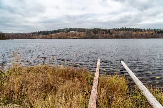 Lake in Sweden in Autumn with a cloudy sky.