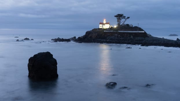 Night falls on a rocky outcropping in Crescent City