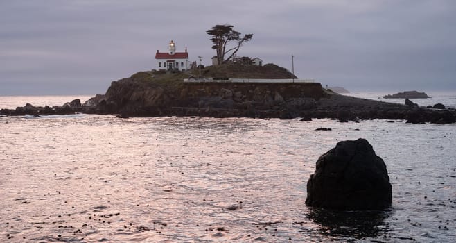 Night falls on a rocky outcropping in Crescent City