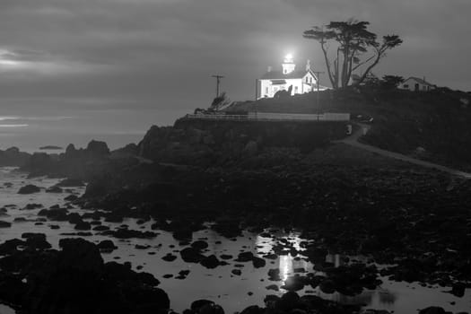 Night falls on a rocky outcropping in Crescent City