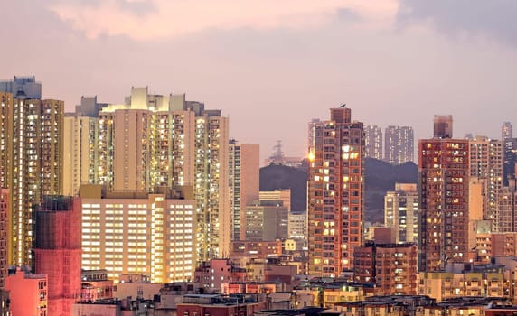 urban city at sunset with all lights lit up