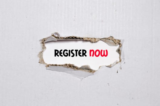 The word register now appearing behind torn paper