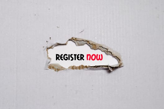 The word register now appearing behind torn paper
