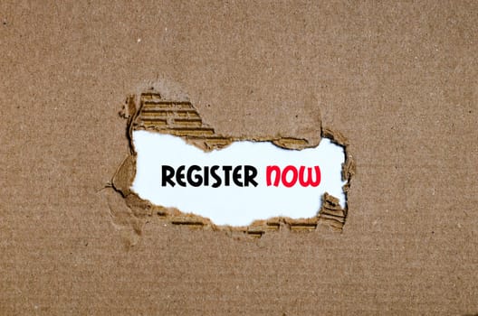 The word register now appearing behind torn paper
