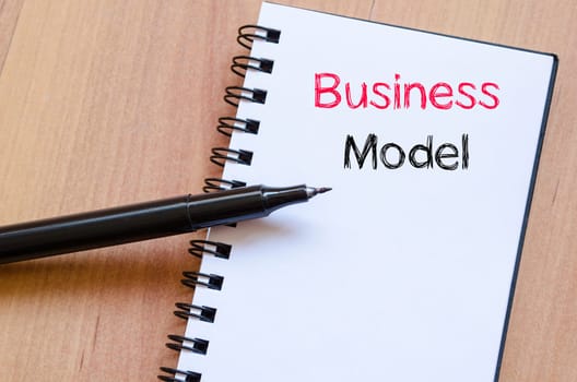 Business model text concept write on notebook