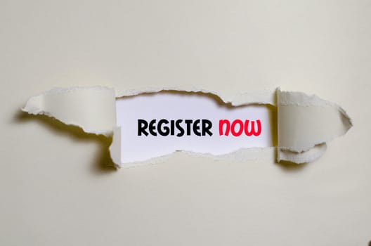 The word register now appearing behind torn paper